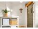 Bathroom features a wood beam accent, decorative wooden cross, and glass shower enclosure at 451 W 152Nd Ave, Broomfield, CO 80023