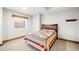 Bedroom with window, carpet, and wooden trim; featuring a colorful quilt on the bed at 451 W 152Nd Ave, Broomfield, CO 80023
