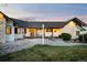Charming ranch-style house features stone accents and a lovely porch, creating an inviting space for relaxation and outdoor enjoyment at 451 W 152Nd Ave, Broomfield, CO 80023