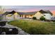 Beautiful single-story home with stone accents, well-kept lawn, and cozy patio area, perfect for outdoor living at 451 W 152Nd Ave, Broomfield, CO 80023
