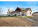 Charming home with a stone chimney, covered patio, and professionally landscaped yard at 451 W 152Nd Ave, Broomfield, CO 80023