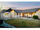 Single-story home with charming stone facade and front porch, offering a welcoming curb appeal and an inviting outdoor space at 451 W 152Nd Ave, Broomfield, CO 80023