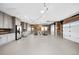 Spacious garage featuring custom cabinetry, wood paneled walls, and string lights at 451 W 152Nd Ave, Broomfield, CO 80023
