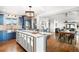 Bright, updated kitchen with stainless steel appliances and granite countertops open to dining area at 451 W 152Nd Ave, Broomfield, CO 80023