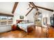 Primary bedroom featuring exposed beams, hardwood floors, and plenty of natural light at 451 W 152Nd Ave, Broomfield, CO 80023