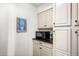 Pantry area with granite countertop, microwave, and cabinetry at 451 W 152Nd Ave, Broomfield, CO 80023