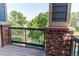 Balcony view with brick posts and black metal handrail overlooking the property at 804 Summer Hawk Dr # 3202, Longmont, CO 80504