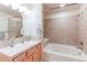 Bathroom with an updated vanity and tile backsplash, plus a bathtub and shower combination at 804 Summer Hawk Dr # 3202, Longmont, CO 80504