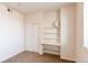 Bedroom featuring carpet, a built-in shelf, and a closet with sliding doors at 804 Summer Hawk Dr # 3202, Longmont, CO 80504