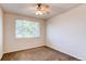 Simple bedroom with a large window and ceiling fan providing natural light and air circulation at 804 Summer Hawk Dr # 3202, Longmont, CO 80504