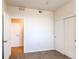 Clean bedroom featuring carpet flooring, a double door closet, and a door leading to another room at 804 Summer Hawk Dr # 3202, Longmont, CO 80504