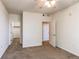 Neutral bedroom featuring two doors and a ceiling fan at 804 Summer Hawk Dr # 3202, Longmont, CO 80504