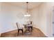 Quaint dining area featuring an ornate table and chairs, perfect for intimate meals at 804 Summer Hawk Dr # 3202, Longmont, CO 80504