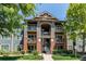 Attractive multi-level condo building featuring balconies, brick accents, and well-maintained landscaping at 804 Summer Hawk Dr # 3202, Longmont, CO 80504
