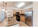 Well-equipped kitchen with stainless steel appliances, ample cabinets, and a breakfast bar at 804 Summer Hawk Dr # 3202, Longmont, CO 80504