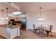 Charming dining area with a kitchen featuring stainless steel appliances and wooden cabinetry at 804 Summer Hawk Dr # 3202, Longmont, CO 80504