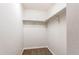Bright, empty walk-in closet with white walls and shelving at 804 Summer Hawk Dr # 3202, Longmont, CO 80504
