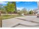 Large, private backyard featuring a concrete patio, lawn, shed, and a wooden fence at 524 Rider Ridge Dr, Longmont, CO 80504