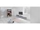 Finished basement featuring yoga mats, TV, modern shelving, and tiled floors at 524 Rider Ridge Dr, Longmont, CO 80504