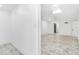 Finished basement with white walls, marble tiled floor, and a bright, open layout at 524 Rider Ridge Dr, Longmont, CO 80504