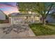 Charming two-story home with stone accents, lush green lawn, and mature tree at 524 Rider Ridge Dr, Longmont, CO 80504