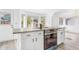 Bright kitchen with granite countertops, stainless steel stove and range hood, and large windows at 524 Rider Ridge Dr, Longmont, CO 80504