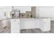 Open concept kitchen featuring modern cabinets, stainless appliances, and granite countertops at 524 Rider Ridge Dr, Longmont, CO 80504