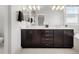 Bathroom features a double sink vanity with dark cabinets, modern lighting, and granite countertops at 1140 S Sherman St, Denver, CO 80210