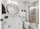 Bathroom features a glass shower, modern vanity and brushed fixtures at 1140 S Sherman St, Denver, CO 80210