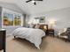 Bright bedroom with large window, ceiling fan, and neutral decor for a cozy and inviting space at 1140 S Sherman St, Denver, CO 80210