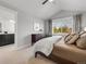 Bright primary bedroom with a large window, modern decor and access to ensuite bathroom at 1140 S Sherman St, Denver, CO 80210