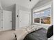 Bedroom with large window offers natural light and neighborhood views, complemented by closet and neutral tones at 1140 S Sherman St, Denver, CO 80210