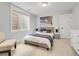 Calming bedroom featuring a plush bed with blue accents and minimalist decor at 1140 S Sherman St, Denver, CO 80210