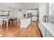 Open concept kitchen with an island flowing into the dining area at 1140 S Sherman St, Denver, CO 80210