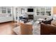 Cozy living room with fireplace, television, and ample natural light at 1140 S Sherman St, Denver, CO 80210