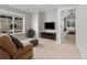 Cozy living room with large windows, a mounted television, and comfortable seating at 1140 S Sherman St, Denver, CO 80210