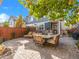 Secluded backyard patio ideal for entertaining with a dining set and lounge chairs at 1140 S Sherman St, Denver, CO 80210