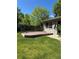 Backyard featuring a wooden deck with railings, perfect for outdoor relaxing and entertaining at 1602 S Lamar St, Lakewood, CO 80232
