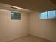 Spacious unfinished basement with natural light from two windows at 1602 S Lamar St, Lakewood, CO 80232