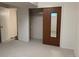 Minimalist bedroom with closet and door, offering versatile space at 1602 S Lamar St, Lakewood, CO 80232
