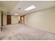 Spacious finished basement featuring neutral carpeting and ample space for recreation and storage at 5721 Everett St, Arvada, CO 80002