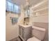 Bathroom with tiled floor, modern sink and toilet at 5721 Everett St, Arvada, CO 80002
