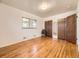 Spacious bedroom with hardwood floors, large closet, and natural light at 5721 Everett St, Arvada, CO 80002