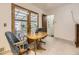 Eat-in kitchen area with patio access, light tile flooring, and comfortable seating at 5721 Everett St, Arvada, CO 80002