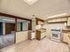 Cozy kitchen with white appliances, wood countertop and wood floor at 5721 Everett St, Arvada, CO 80002