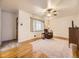 Comfortable living room with hardwood floors, ceiling fan, and natural light at 5721 Everett St, Arvada, CO 80002