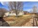 Large backyard featuring a tree, fence, and patio, ideal for outdoor living at 6295 Clayton Cir, Frederick, CO 80530