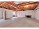 Unfinished basement featuring an open layout with concrete flooring and exposed ceiling beams and support poles at 6295 Clayton Cir, Frederick, CO 80530