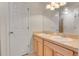 Bathroom featuring double sinks, ample lighting, and neutral tones at 6295 Clayton Cir, Frederick, CO 80530