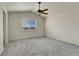 Spacious bedroom with plush carpet and a ceiling fan at 6295 Clayton Cir, Frederick, CO 80530